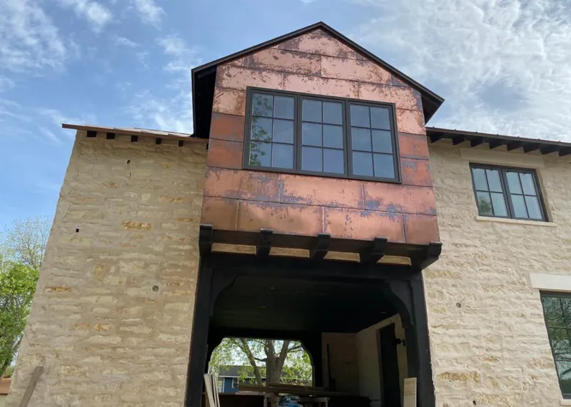 Copper metal panel facade on a stone building for Skylight Installation in Powder Springs
